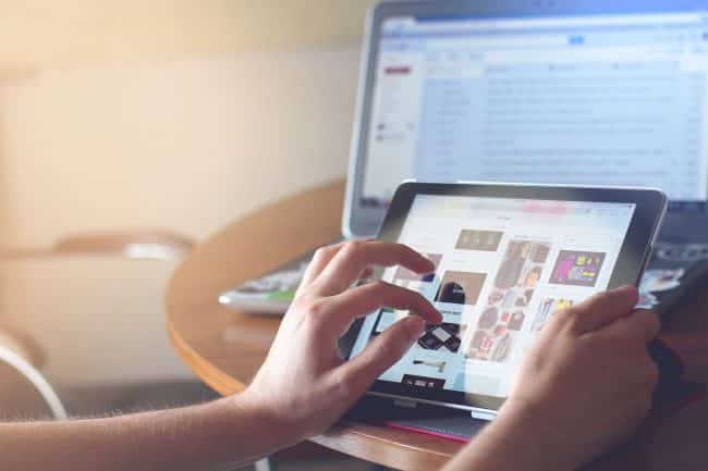 person touching a tablet