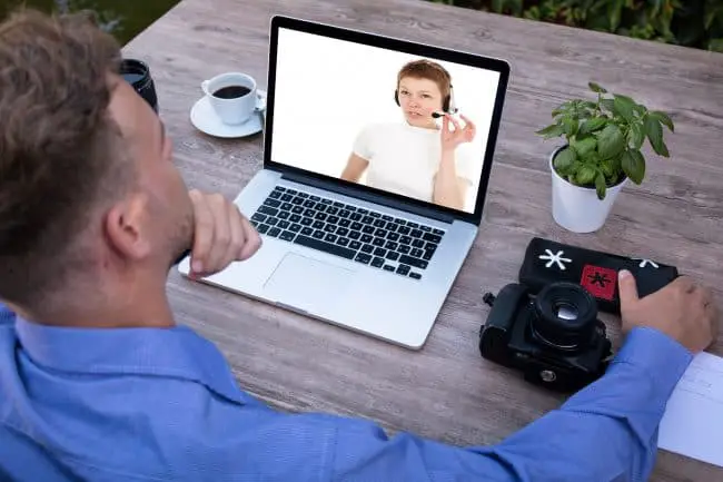 man watching on his laptop